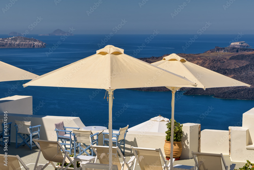 Patio umbrellas and ocean views in Santorini, Greece