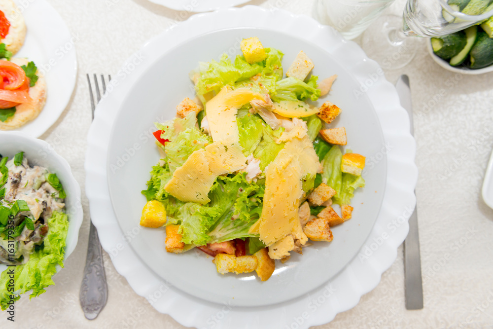 Appetizing meat salad with breadcrumbs cheese and lettuce close-up. Appetizing meat salad with breadcrumbs cheese and lettuce close-up.