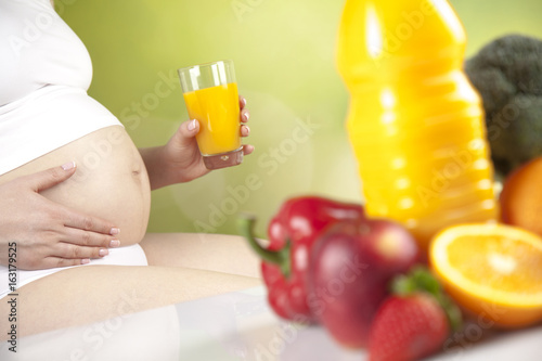 Pregnancy, healthy food and people concept
