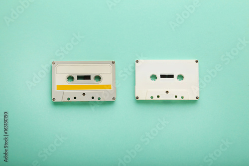 White cassette tapes on mint background