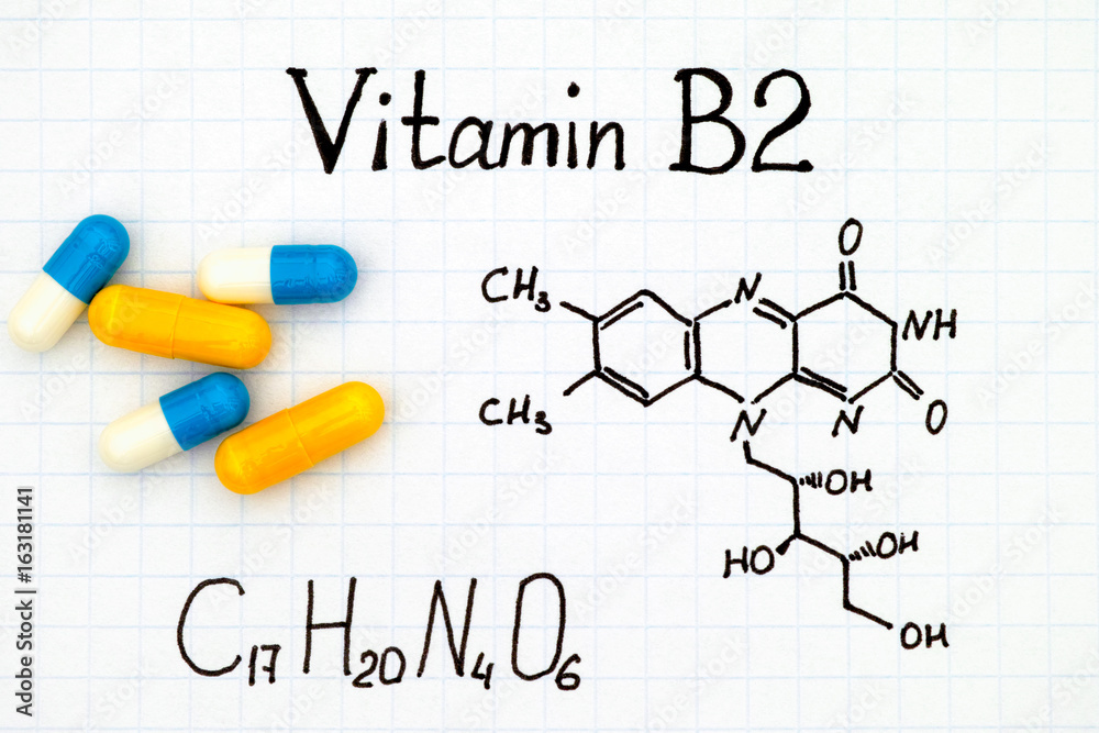Chemical formula of Vitamin B2 and pills. Chemical formula of Vitamin B2 and pills.