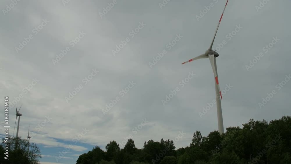 Driving by the wind farm in the middle of farmlands. Driving by the wind farm in the middle of farmlands.