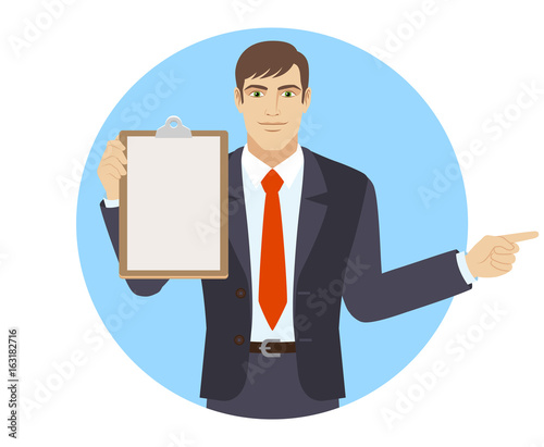 Businessman holding the clipboard and pointing something beside of him