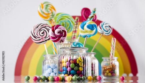 Glass jars in Colorful candies,lollipops and gum balls