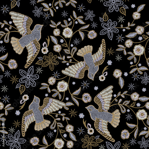 Embroidery ethnic seamless pattern with pigeons and flowers.