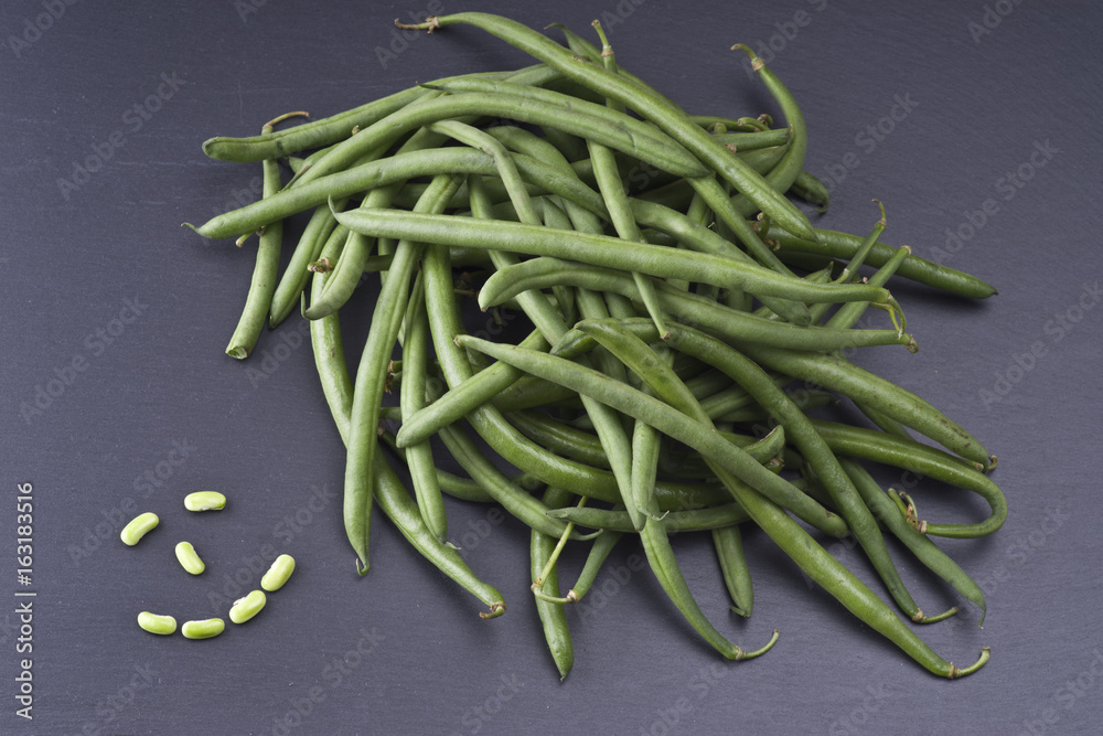 Group of fresh green bean on slate stone plate Group of fresh green bean on slate stone plate