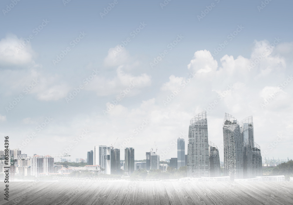 Modern urban buildings skyscrapers blue cloudy sky background and wooden textured platform