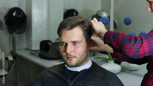 The young man at the hairdresser salon hairstyle make model 