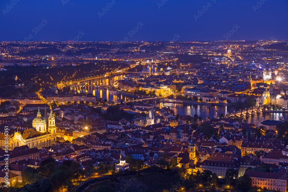 Prague at twilight blue hour, view of Charles Bridge on Vltava with Mala Strana, Old Town and Prague castle