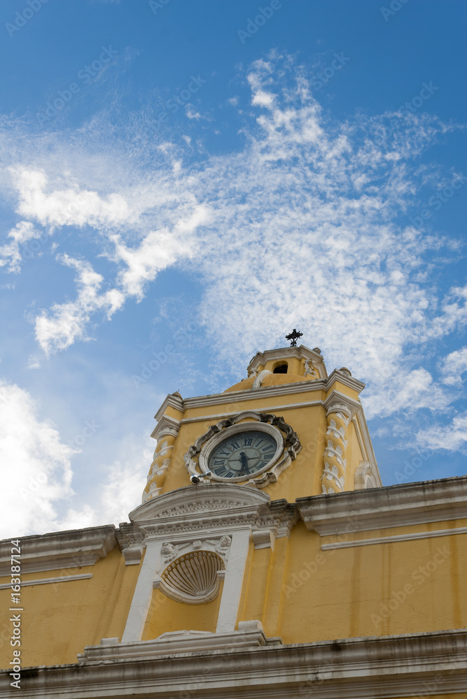 Santa Catalina Arch & ruins in Spanish colonial town & UNESCO World Heritage Site and clouds.