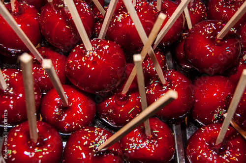 Red candy apples in sugar icing toffee