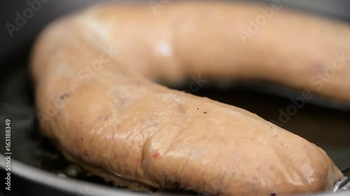 frying typical portuguese sausage in oil photo