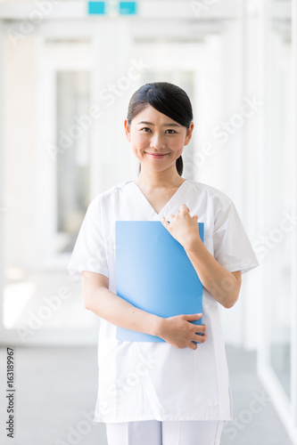 portrait of young asian nurse in hospital