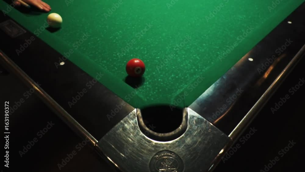 Table Pool Hit Playing billiards, blowing a cue on the ball, the ball hit the pocket ...