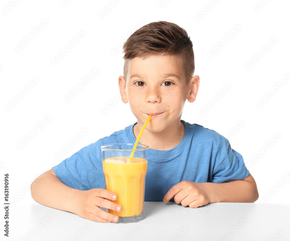 Cute little boy drinking juice on white background Cute little boy drinking juice on white background
