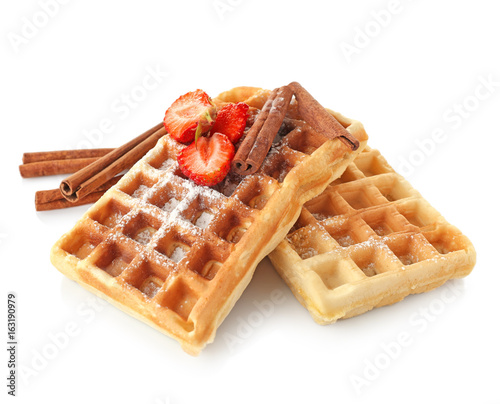 Delicious cinnamon waffles with strawberry isolated on white