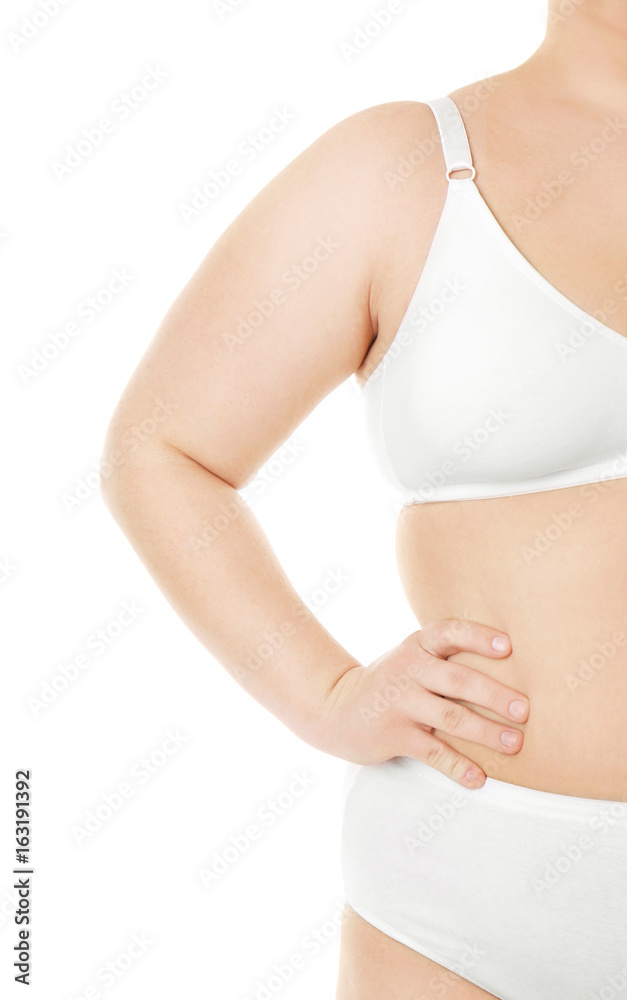 Overweight young woman in underwear on white background. Diet concept Overweight young woman in underwear on white background. Diet concept
