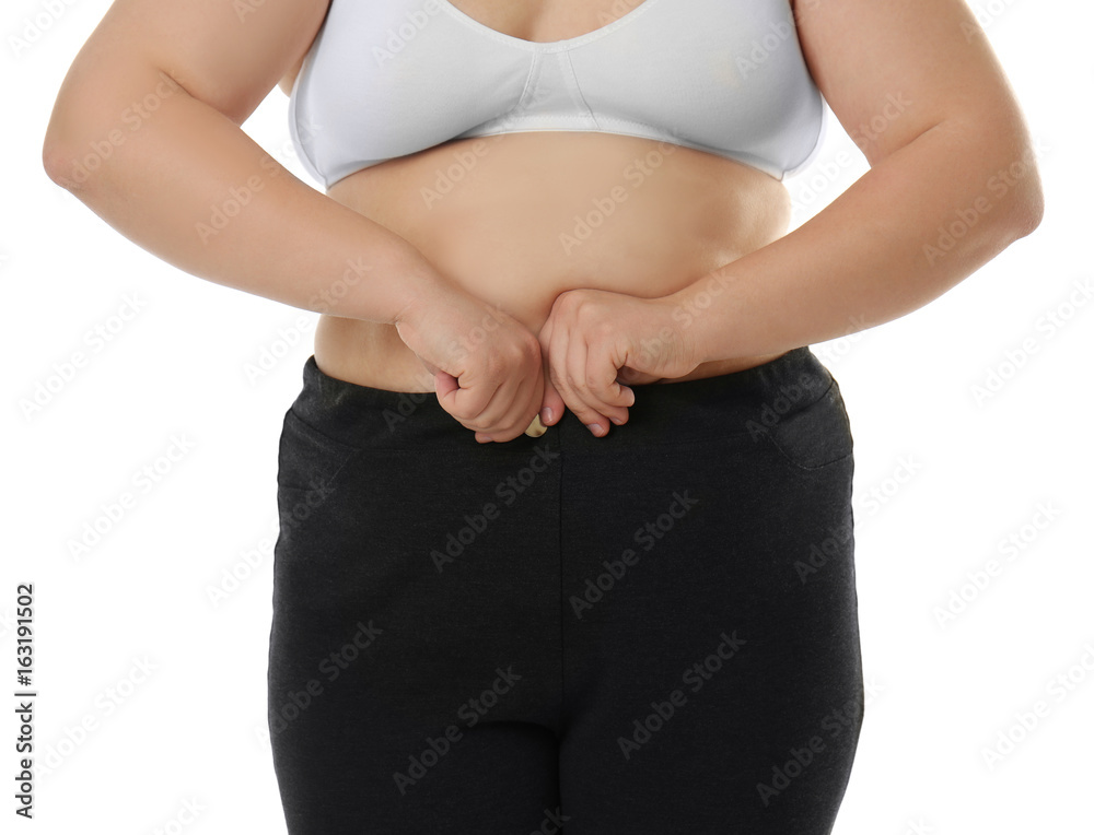 © Africa Studio - Overweight woman in bra and trousers on white background. Diet concept