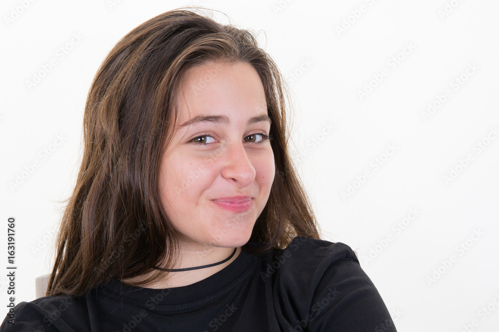 portrait of attractive teenager girl smiling in cheerful mood, over white portrait of attractive teenager girl smiling in cheerful mood, over white