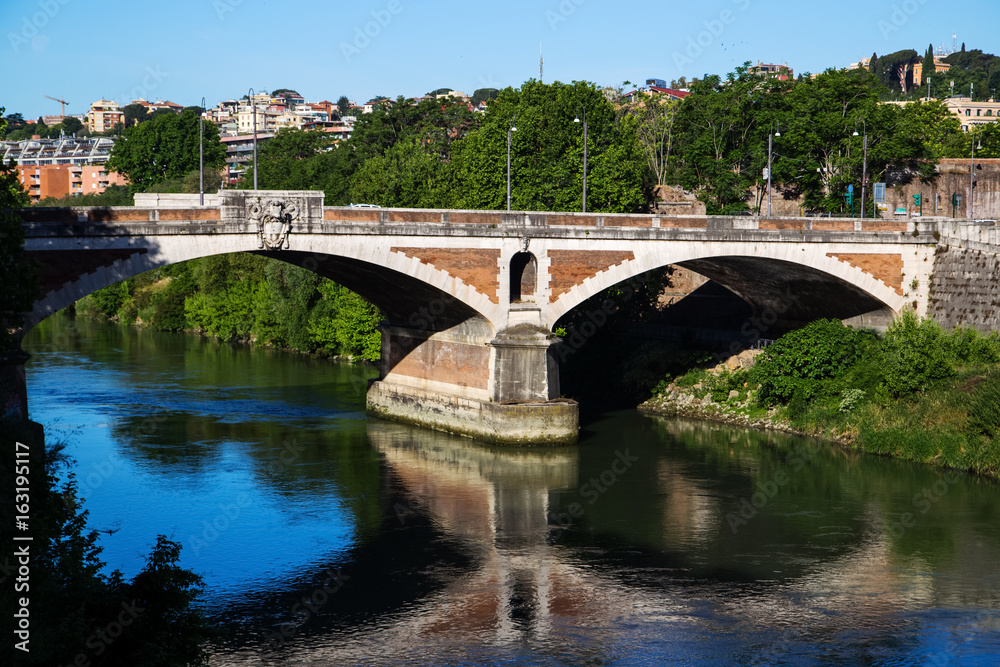 Bridge over Tiber river at summer morning. Rome, Italy