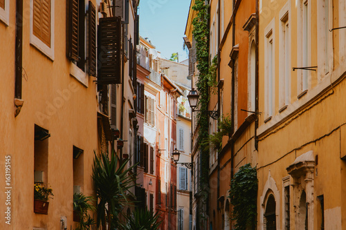 Narrow street in Rome, Italy at summer