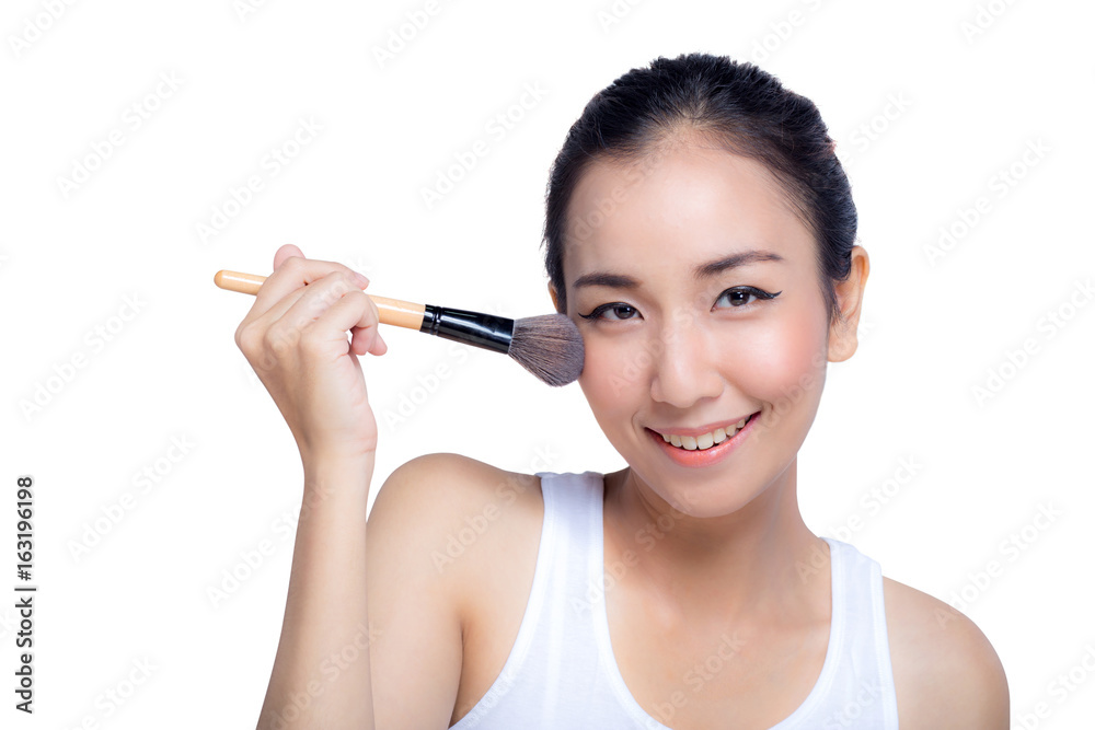 Portrait of the beautiful woman with makeup brushes near face Portrait of the beautiful woman with makeup brushes near face