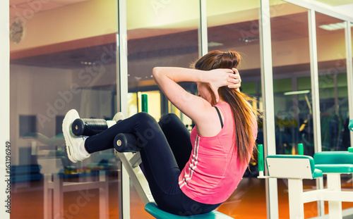 Sporty woman doing sit-up