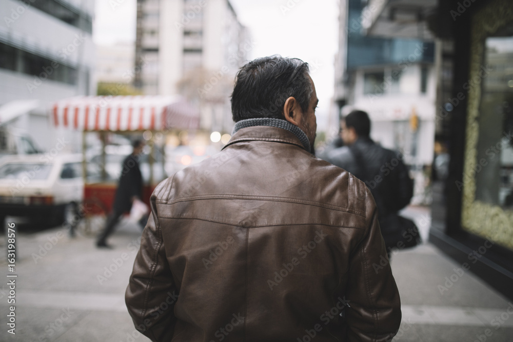 Man Walking At City Street