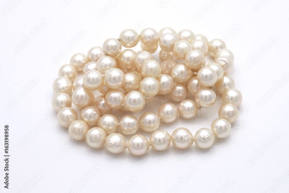 Closeup Pile of Pearls on White Background