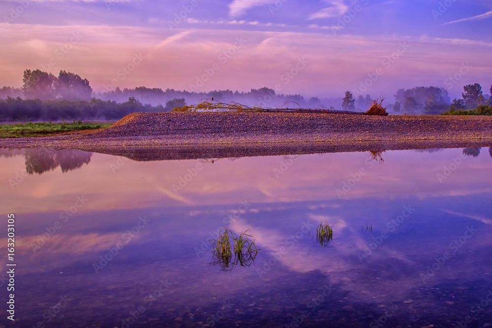 Wild river landscape with sunset blue colors
