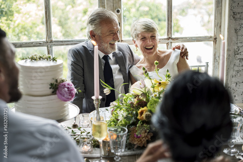 Senior Caucasian Couple Sitting Together Cheerful