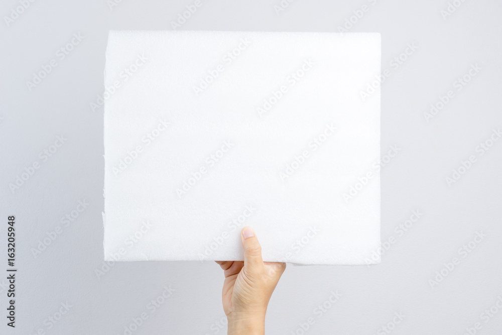 Hand holding foam fiber board Hand holding foam fiber board