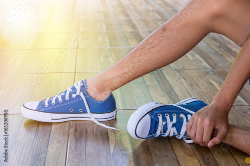 Teenager boy wear blue canvas sneaker   flare effect