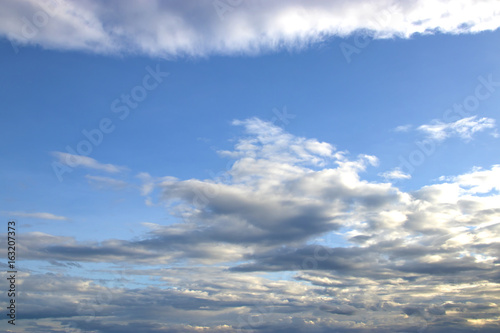 blue sky with clouds background. © kannika2012