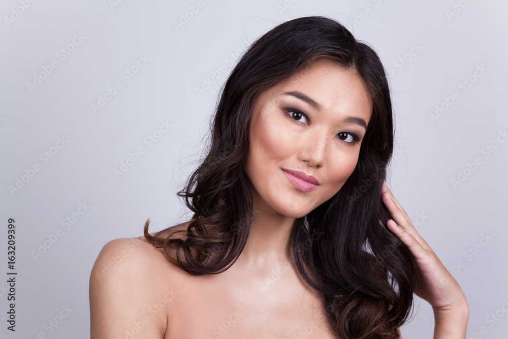Portrait of a beautiful asian woman with naked shoulders. Portrait of a beautiful asian woman with naked shoulders.