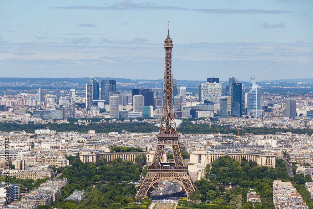 Eiffel tower in Paris against La Defense district
