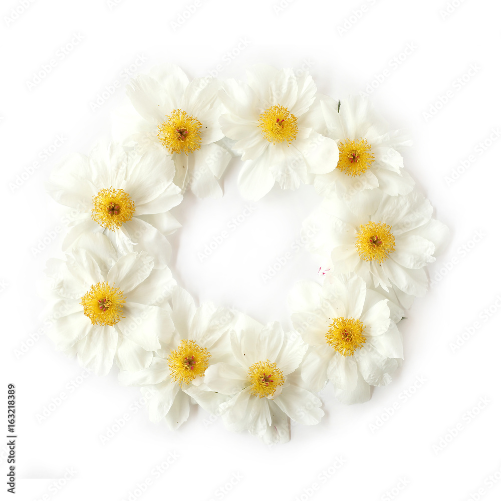 Fototapeta premium Flat lay floral wreath frame with white peony flowers on white background. Top view.