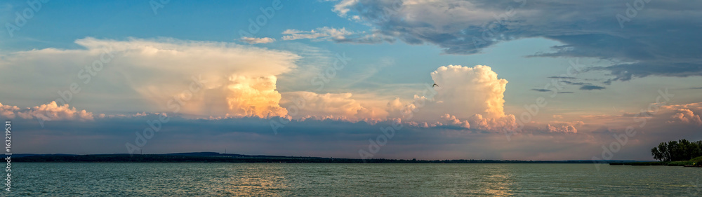 White cumulus clouds and a blue sky