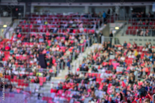 Blurred crowd of spectators on a stadium tribune