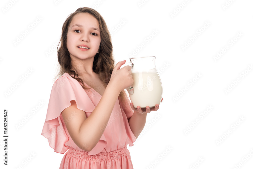 portrait of young smiling teenager girl with jug of milk portrait of young smiling teenager girl with jug of milk