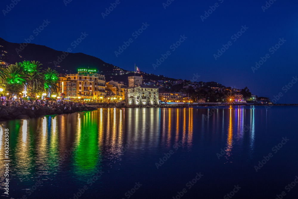 RAPALLO, ITALY JULY, 1, 2015 - View of Rapallo, Genoa (Genova) province and the castle on the sea by night.
