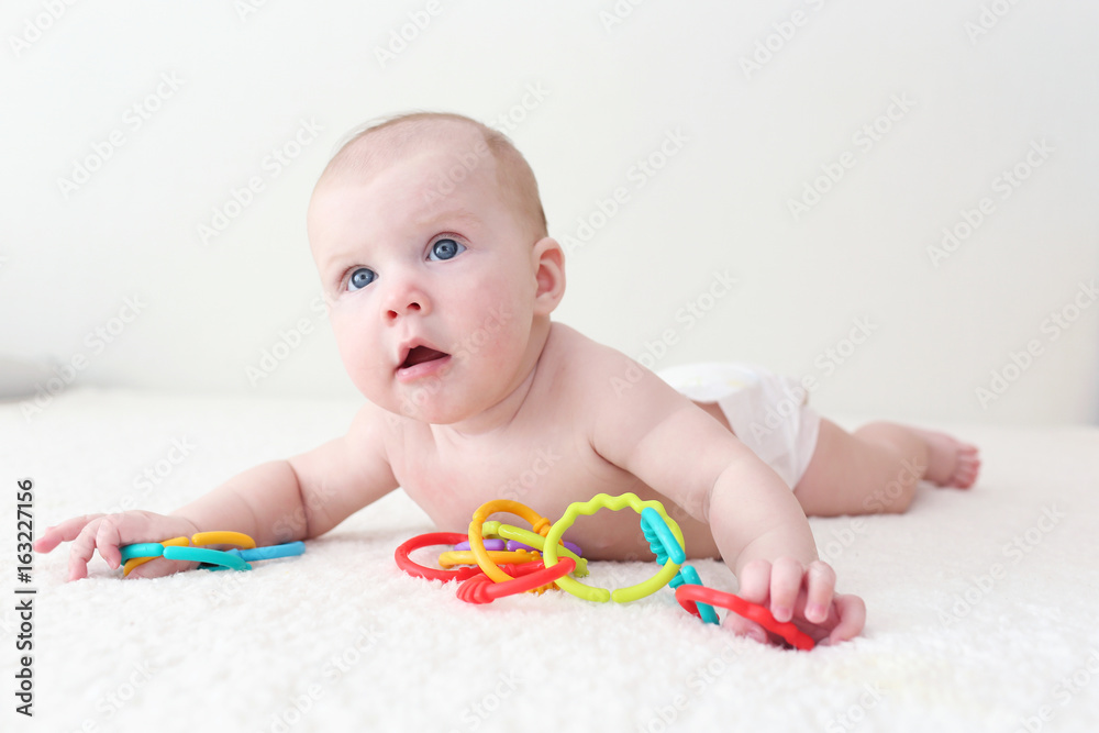 4 months baby with educational toy teether at home 4 months baby with educational toy teether at home