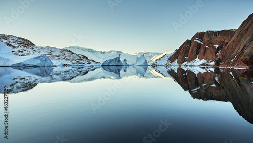 iceberg floating in greenland fjord