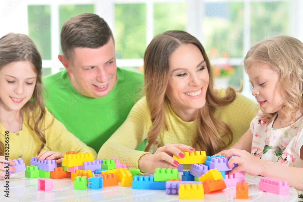 Family collecting blocks together