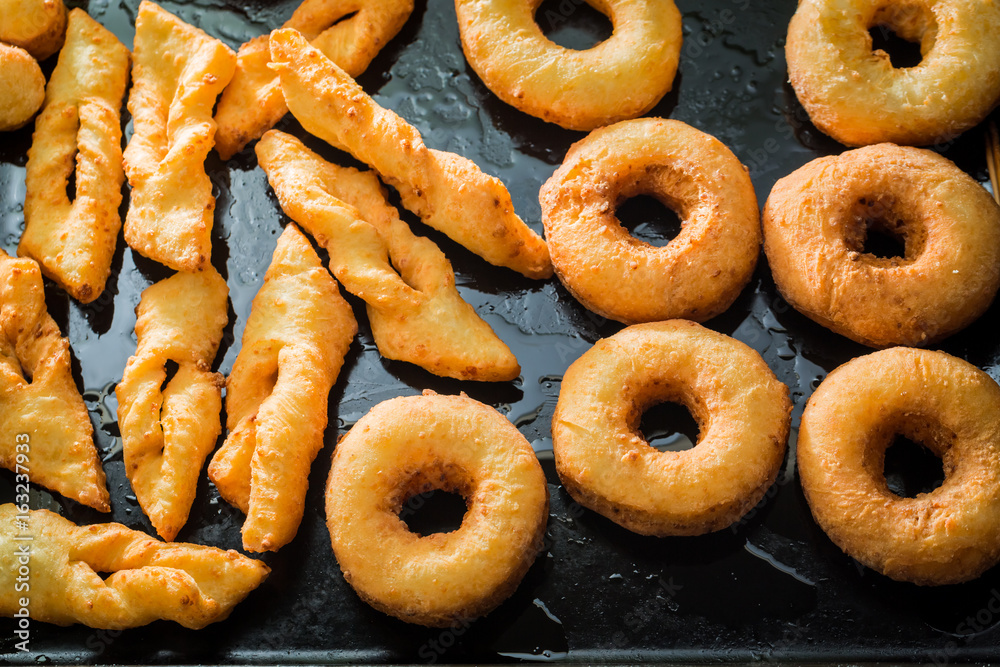 Sweet and hot golden donuts ready to eat Sweet and hot golden donuts ready to eat