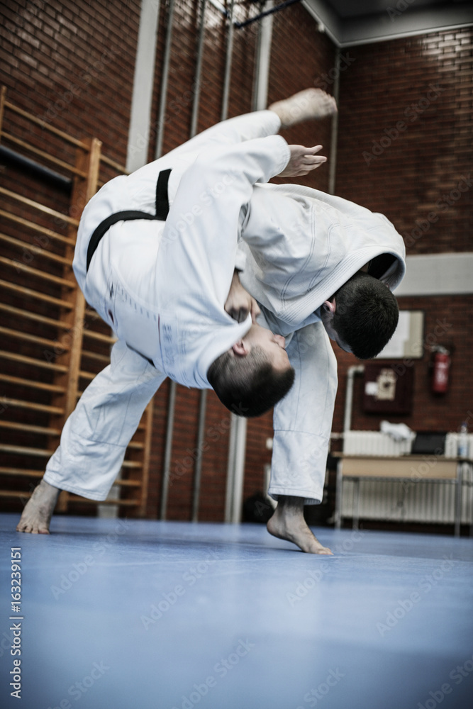 Fototapeta premium Two young males practicing judo together.