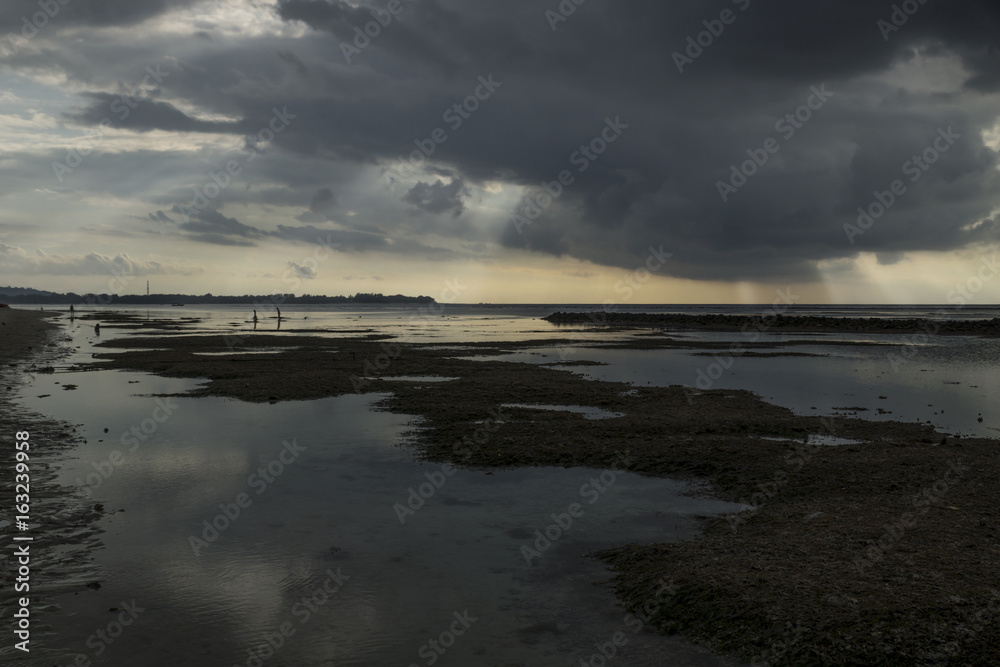 Raincloud with sunbeams at Gili Air, Lombok, Indonesia