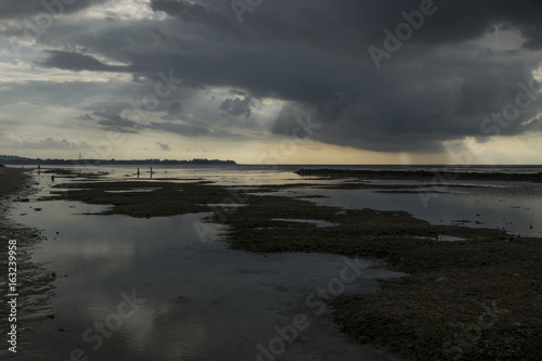 Raincloud with sunbeams at Gili Air  Lombok  Indonesia