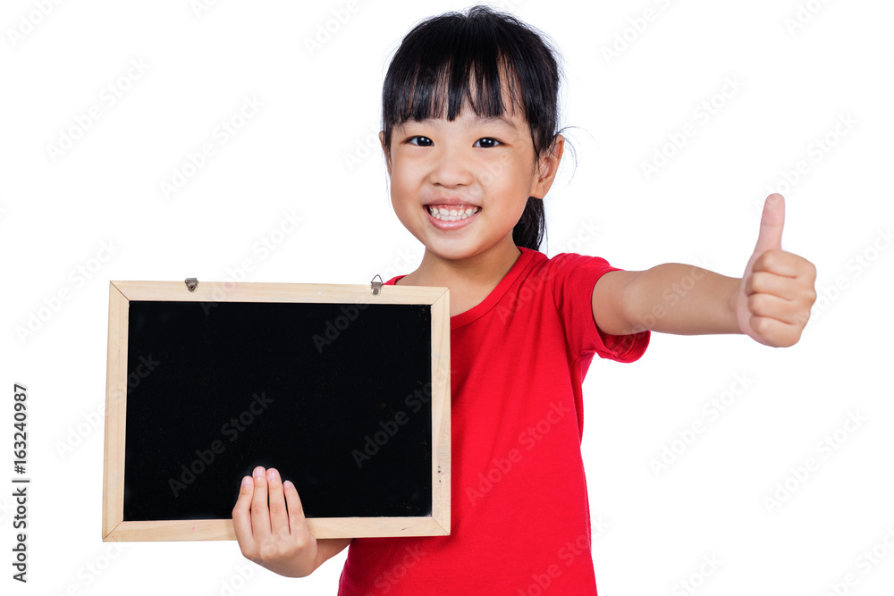 Asian little Chinese girl holding a blackboard with thumbs-up Asian little Chinese girl holding a blackboard with thumbs-up