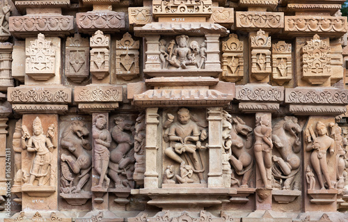 Ancient stone bas-relief at famous jain temple in Khajuraho, India photo